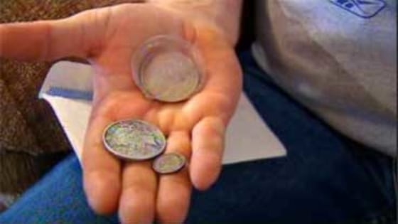 Image: Jimmy Colson displays coins